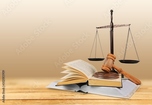 Justice Scales and books and wooden gavel on table. Justice concept