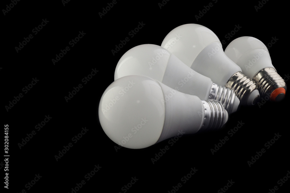 white LED lamps lying fan on a black background white LED lamps lying fan on a black background