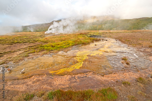 Steam and Colorful Bacteria at a Thermal Area