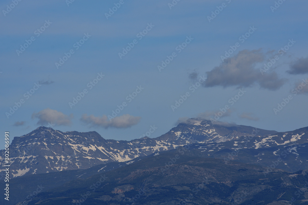 Sierra Nevada with snow and clouds