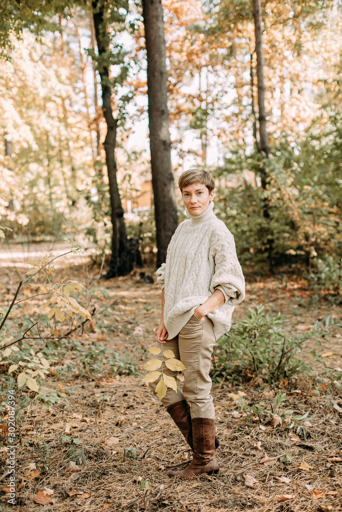 Fototapeta premium autumn yellow leaf fall conceptual girl park