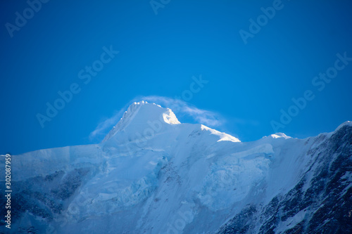 icey mountain with cloud cap