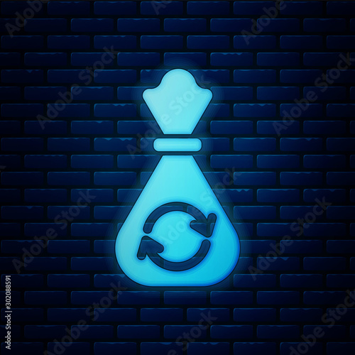 Glowing neon Garbage bag with recycle symbol icon isolated on brick wall background. Trash can icon. Recycle basket sign. Vector Illustration