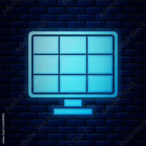 Glowing neon Solar energy panel icon isolated on brick wall background. Vector Illustration