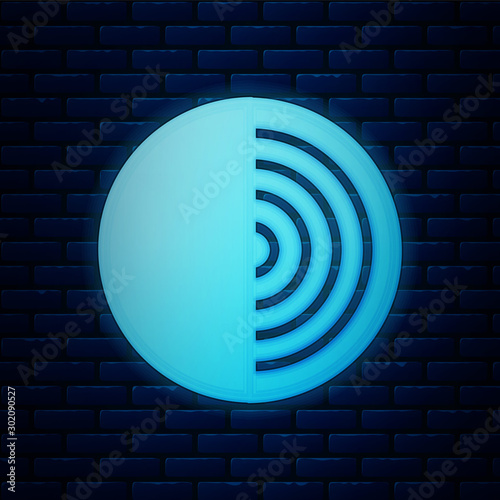 Glowing neon Earth structure icon isolated on brick wall background. Geophysics concept with earth core and section layers earth. Vector Illustration