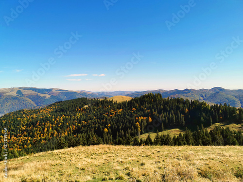 Early Autumn on mountain landscape photo