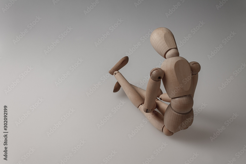 human figurine depicting a lonely bored person, the concept of abandonment and uselessness, despair and depression, autism, mental disorders human figurine depicting a lonely bored person, the concept of abandonment and uselessness, despair and depression, autism, mental disorders