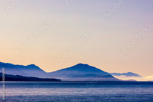 Pastel Sunset over Mountains and Ocean