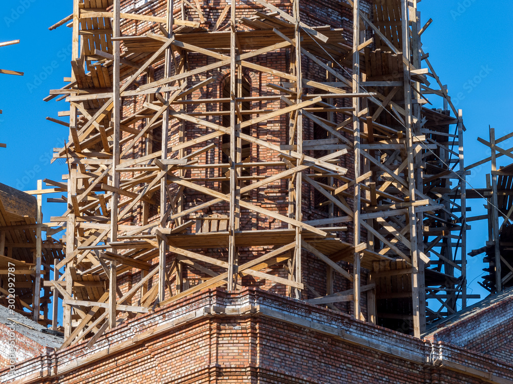 scaffolding installed on the building to restore the facade repair, construction