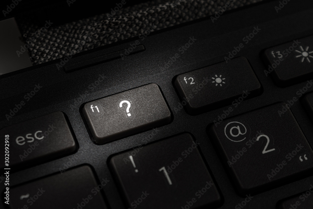 question mark on the keyboard key of a personal computer or laptop close-up macro question mark on the keyboard key of a personal computer or laptop close-up macro