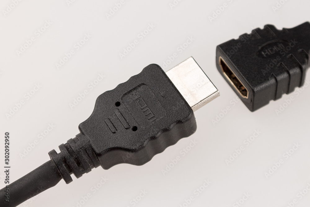 mini HDMI adapter and HDMI connector to connect external monitors to computer with HDMI cable isolated on white background