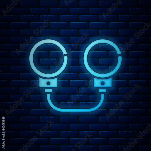 Glowing neon Handcuffs icon isolated on brick wall background. Vector Illustration