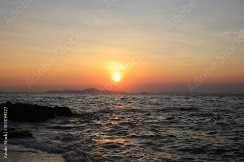 Sunset over the sea and island