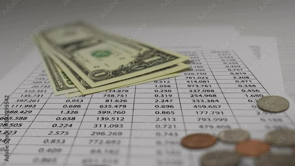 Coin and Banknotes with Financial Data Animation On White Paper. Seamless Loops. Coin and Banknotes with Financial Data Animation On White Paper. Seamless Loops.