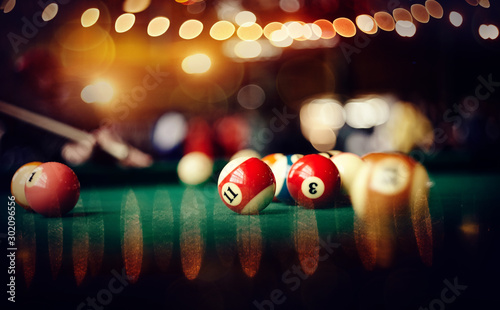 Colorful billiard balls on a billiard table.