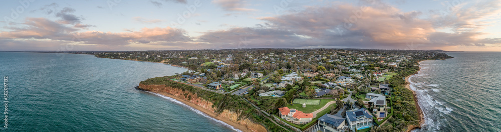 Wide aerial panorama of Mount Eliza suburb luxurious real estate on Mornington Peninsula at sunset