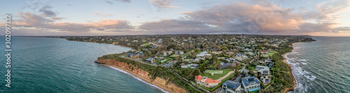 Wide aerial panorama of Mount Eliza suburb luxurious real estate on Mornington Peninsula at sunset