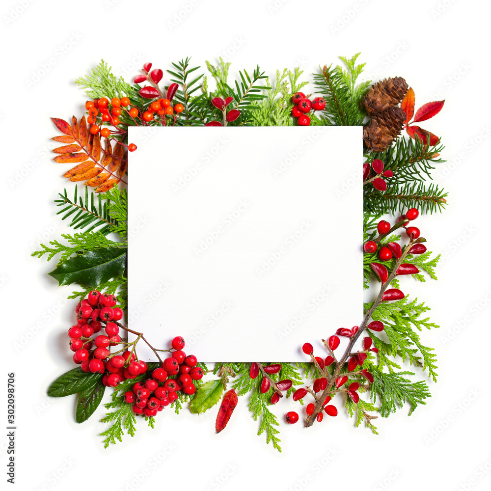 Layout made of Christmas tree branches and paper card note frame on white background. Mockup, flat lay. New Year winter season concept