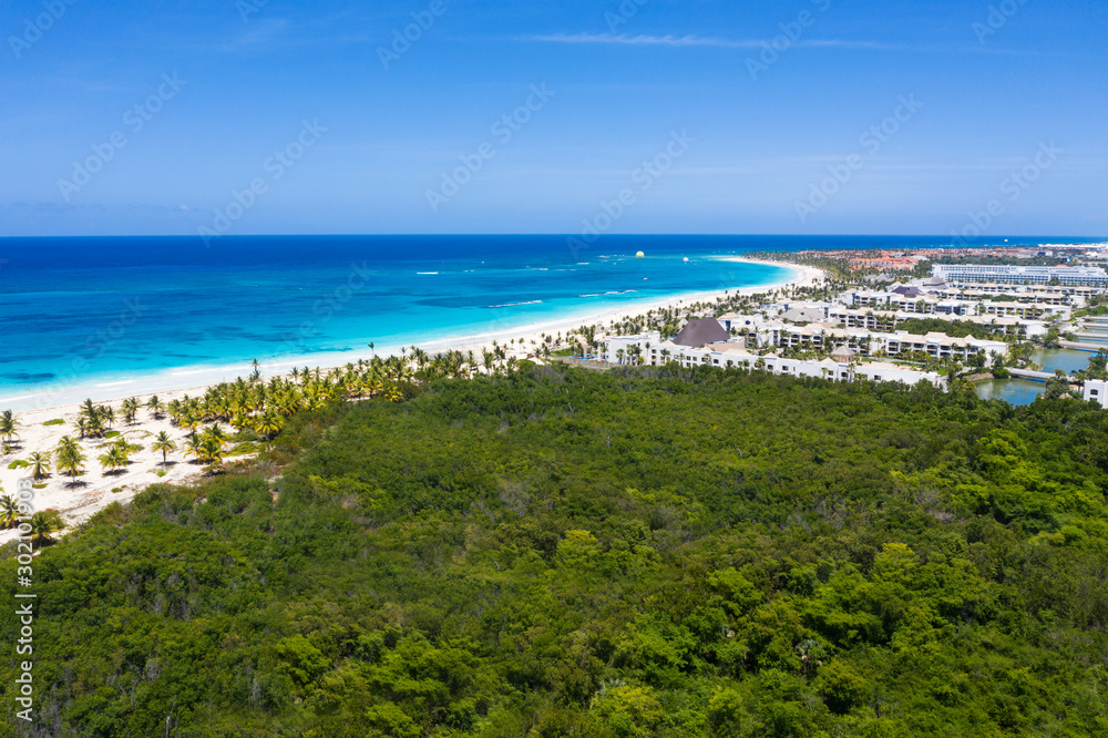 Caribbean beach of Atlantic ocean with luxury resorts, travel destination