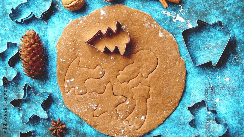 Christmas baking concept. Gingerbread dough with different cutter shapes