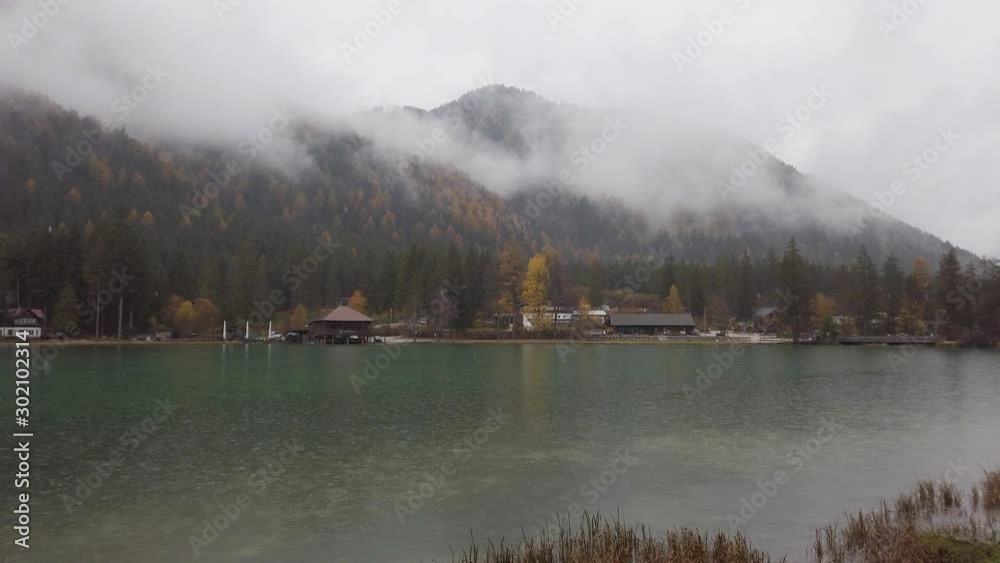 Foggy autumn morning at Lake Dobbiaco, Province of Bolzano, Trentino Alto Adige, Italy. Foggy autumn morning at Lake Dobbiaco, Province of Bolzano, Trentino Alto Adige, Italy.