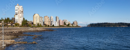 West Vancouver, British Columbia, Canada. Beautiful panoramic view of residential buildings on Pacific Ocean Coast during a sunny summer evening. © edb3_16