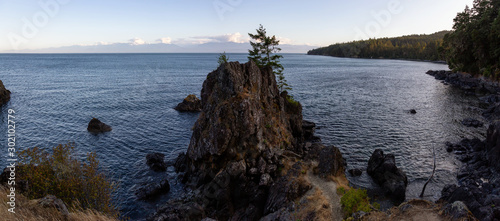 Creyke Point, East Sooke Regional Park, Sooke, Vancouver Island, British Columbia, Canada. Beautiful panoramic landscape view of a rocky shore during a sunny summer sunset.
