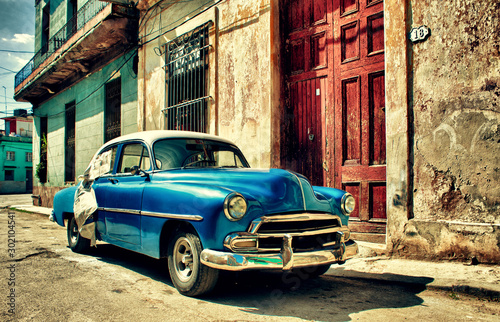 Old classic car parked in a street of Havana city © javier
