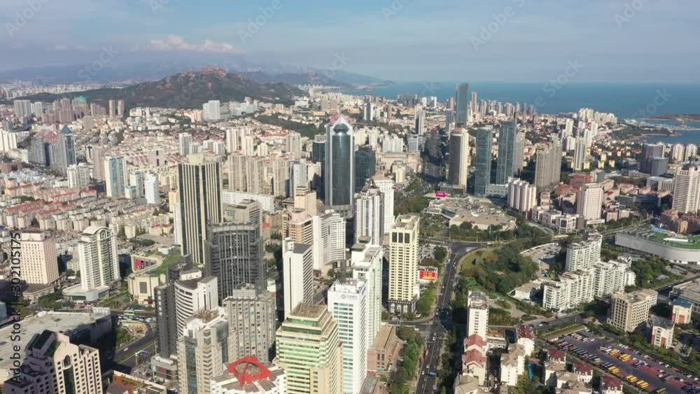 Aerial view of commercial business district mixed with residential buildings in central Qingdao, China Aerial view of commercial business district mixed with residential buildings in central Qingdao, China