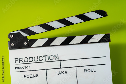 movie clapper on green background