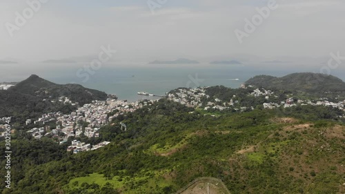 Aerial view the tourist village of Yung Shue Wan, Lamma Island. In the background the sea and other islands. Hong Kong, China photo