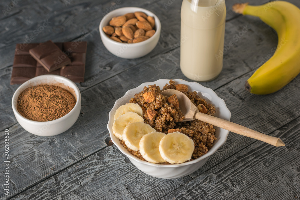 Bowl of quinoa porridge with chocolate and almond milk. Bowl of quinoa porridge with chocolate and almond milk.