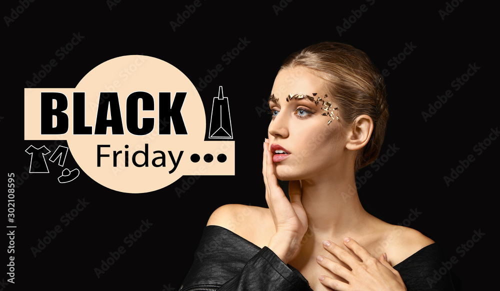 Young woman with creative makeup and text BLACK FRIDAY on dark background Young woman with creative makeup and text BLACK FRIDAY on dark background