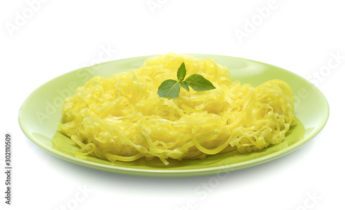 yellow noodles on dish isolated on white background