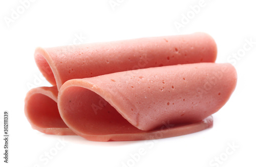 Boiled sausage slices isolated on white
