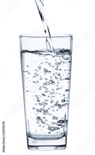 pouring water on a glass on white background clipping path