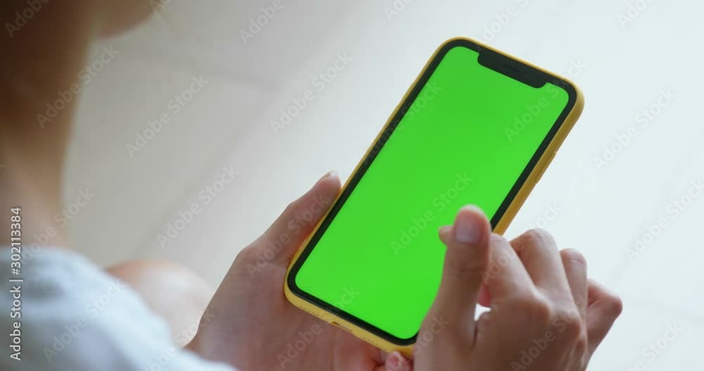 Finger touch on the chroma key of the cellphone at home Finger touch on the chroma key of the cellphone at home