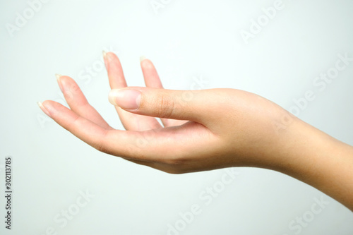Beautiful hand of female on a white background. Concept beauty and hydration of the skin.