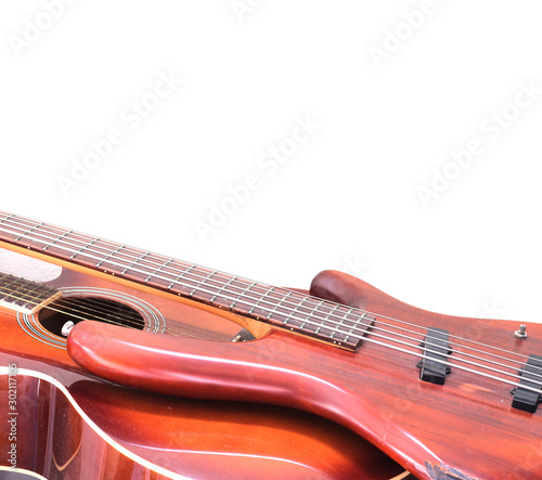 vintage bass electric guitar on wall background
