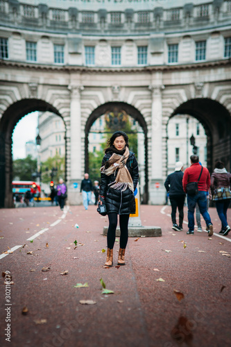 Asian model walking on London street © YiuCheung