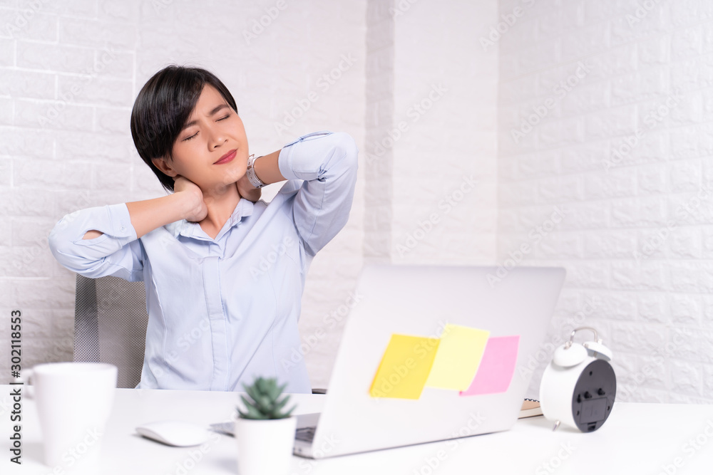 Woman has body pain at office: Office syndrome concept Woman has body pain at office: Office syndrome concept