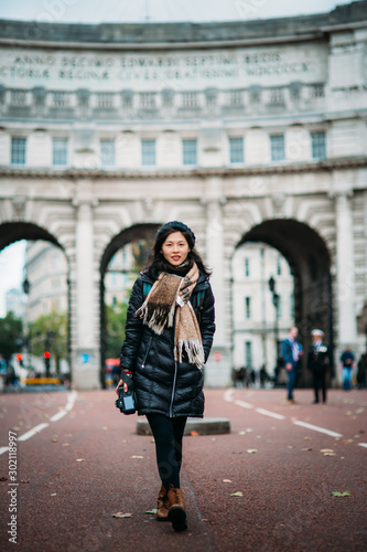Asian model walking on London street