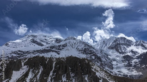 Wallpaper Mural Day timelapse overlooking the Annapurna Mountain Range with clouds on a sunny day from Manang, Nepal. Wide shot. Torontodigital.ca