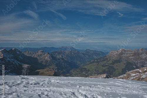 View from Mt. Titlis in Switzerland in winter. The Titlis is a mountain, located on the border between the Swiss cantons of Obwalden and Bern