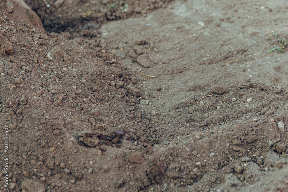 brown soil on the ground as texture and background. brown soil on the ground as texture and background.