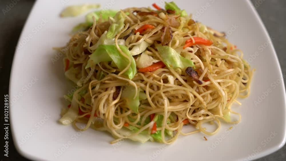 fried noodles with ingredient on plate fried noodles with ingredient on plate