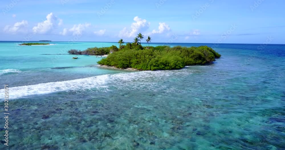 A Lush Island In Fiji While The Crashing Beach Waters Runs Softly - Wide Shot