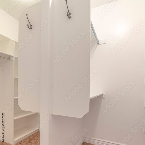 Square frame Interior of a dual walk in wardrobe