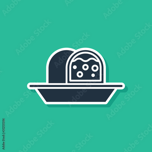 Blue Marzipan sponge cake icon isolated on green background. Merry Christmas and Happy New Year. Vector Illustration