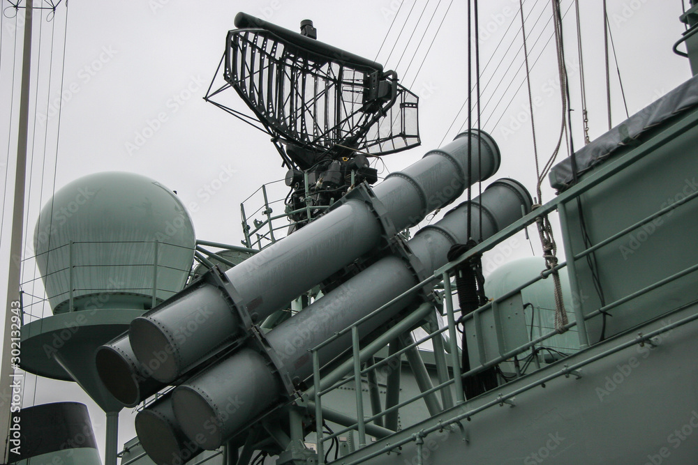Missile launcher and radar system on a NATO warship. Rainy gloomy weather. Missile launcher and radar system on a NATO warship. Rainy gloomy weather.